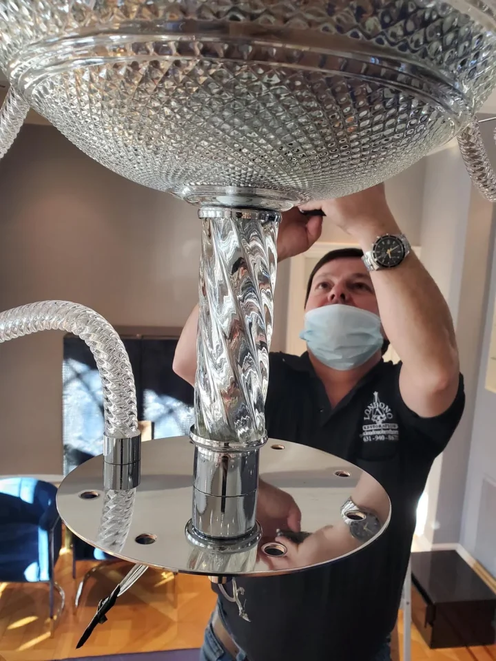londono brothers working on chandelier
