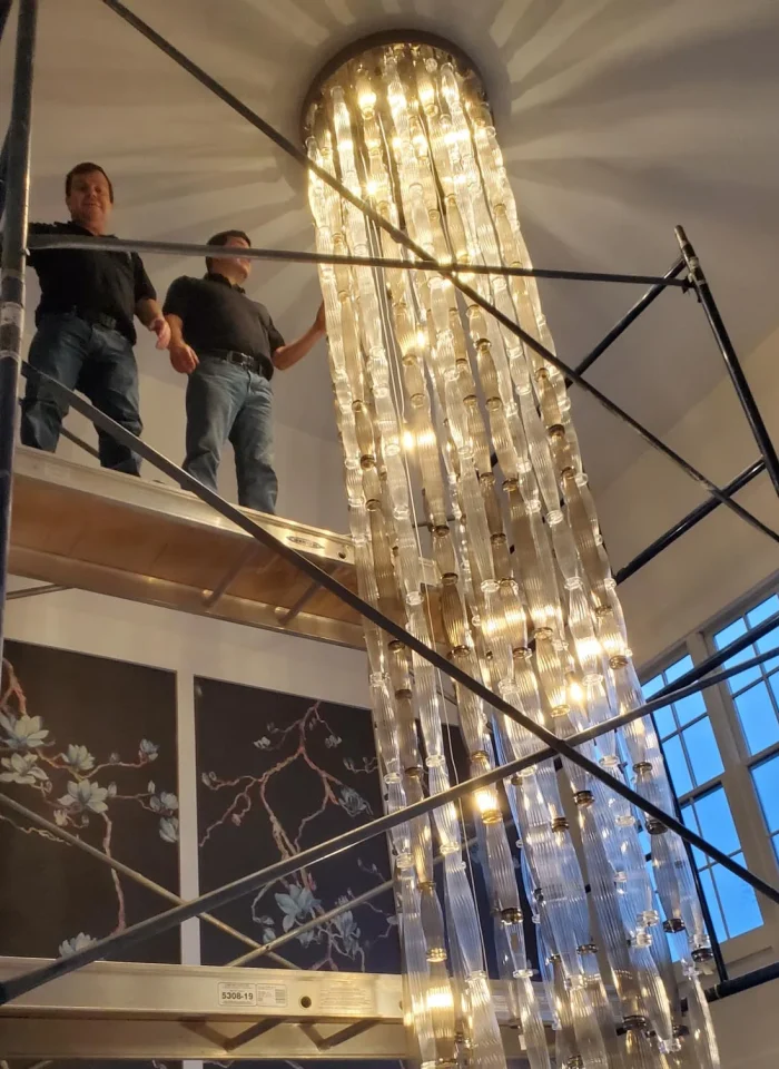 londono brothers working on chandelier