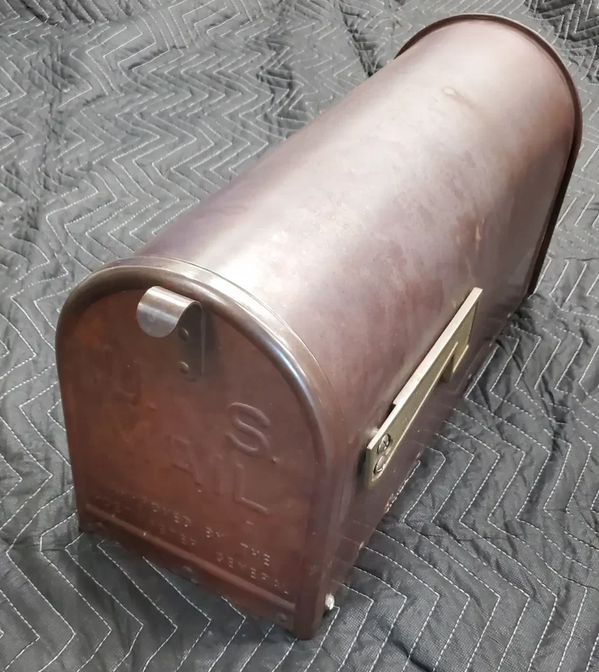 copper mailbox before restoration