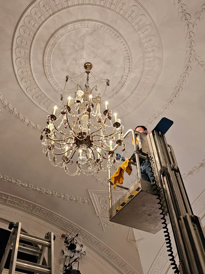 londono brothers working on chandelier install