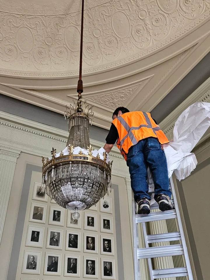 londono brothers working on chandelier install