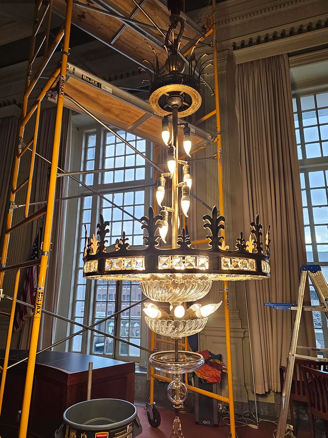 working on chandelier with scaffolding