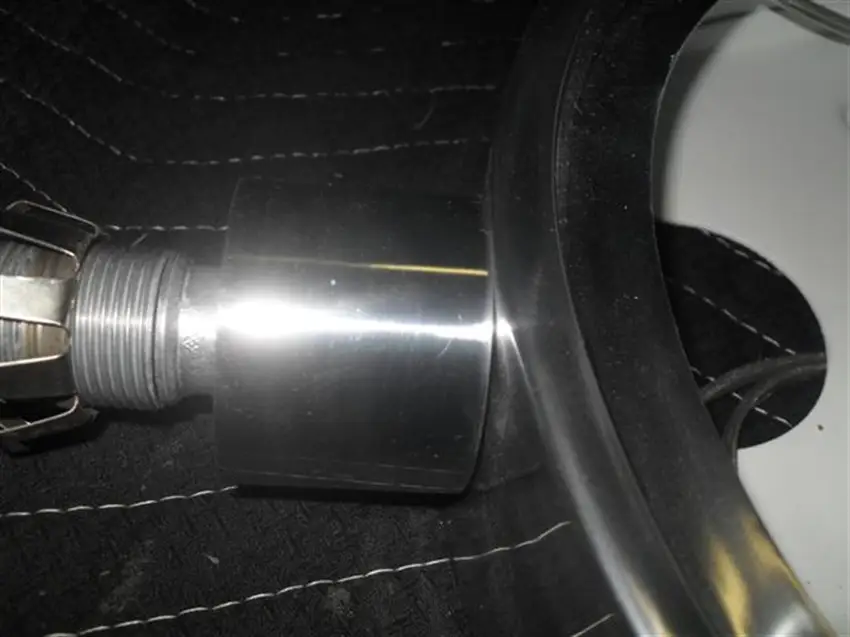 polishing aluminum light fixture closeup