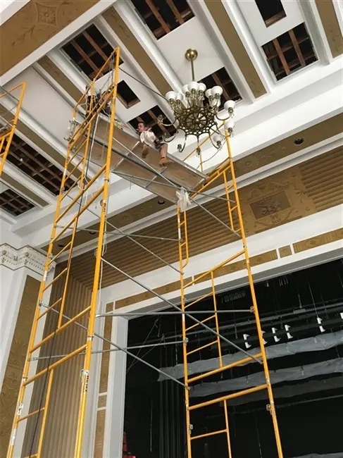 chandelier cleaning in progress