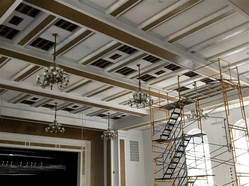 4 hanging chandeliers during restoration
