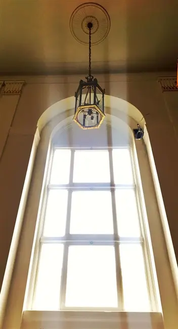 hangin chandelier sunlight through window